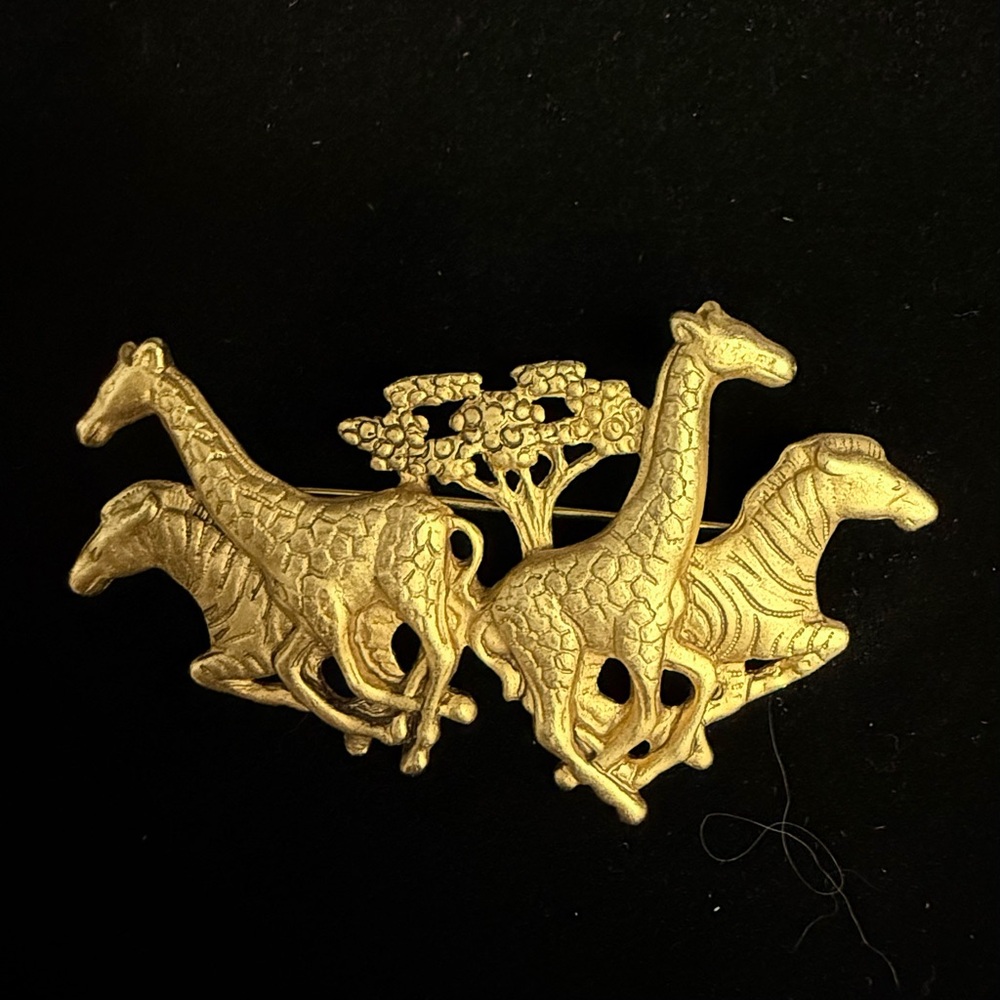 AJC 1980s gold tone Safari Brooch